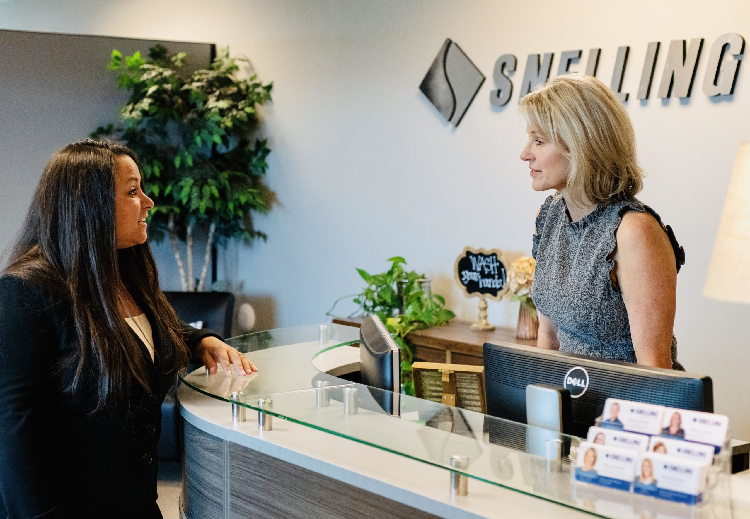 Photo of Director of Client Relations for Snelling Staffing of Northern Colorado, Melanie Ecker, greeting female visitor in the Loveland, Colorado office.